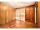 Wood-paneled bedroom with hardwood floors and natural light at 1491 Boulderwoods Dr, Atlanta, GA 30316