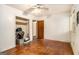 A standard bedroom features hardwood floors, closet, and ceiling fan at 1491 Boulderwoods Dr, Atlanta, GA 30316