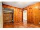 This bedroom has hardwood floors and wood paneling at 1491 Boulderwoods Dr, Atlanta, GA 30316
