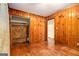 Cozy wood-paneled bedroom features hardwood floors and a closet at 1491 Boulderwoods Dr, Atlanta, GA 30316