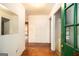 Inviting entryway with hardwood floors and fresh, green painted door frame at 1491 Boulderwoods Dr, Atlanta, GA 30316