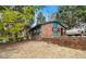 A red brick house with a lush green lawn and mature trees at 1491 Boulderwoods Dr, Atlanta, GA 30316