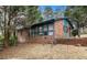 Brick home with a large sunroom at 1491 Boulderwoods Dr, Atlanta, GA 30316