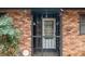 Inviting front door with security bars providing charm and security at 1491 Boulderwoods Dr, Atlanta, GA 30316