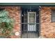 A close up of the front door and secure gate of this brick home at 1491 Boulderwoods Dr, Atlanta, GA 30316