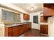 Functional galley kitchen with practical design and ample storage with wooden cabinetry at 1491 Boulderwoods Dr, Atlanta, GA 30316