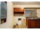 Utility room with cabinet storage above the double sink at 1491 Boulderwoods Dr, Atlanta, GA 30316