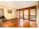 Spacious living room featuring hardwood floors and large windows allowing ample natural light at 1491 Boulderwoods Dr, Atlanta, GA 30316