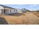 Expansive backyard showing well-maintained lawn behind the home, offering a serene outdoor space at 1783 Juniper Berry Way, Loganville, GA 30052