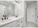 Bathroom with dual sinks, quartz countertop and modern black faucets at 1783 Juniper Berry Way, Loganville, GA 30052