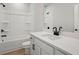 Modern bathroom featuring a sleek vanity and a shower-tub combination at 1783 Juniper Berry Way, Loganville, GA 30052