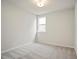 Light filled bedroom features neutral carpet and a view from the window at 1783 Juniper Berry Way, Loganville, GA 30052
