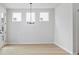 Bright dining room with hardwood floors, chandelier, and natural light at 1783 Juniper Berry Way, Loganville, GA 30052