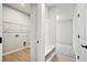 Functional mudroom features a bench with storage and a coat rack at 1783 Juniper Berry Way, Loganville, GA 30052