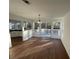 Bright dining area with hardwood floors, stylish lighting, and sliding glass doors leading to the deck at 3210 Linden Dr, Lawrenceville, GA 30044