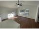 Bright and airy living room with modern ceiling fan, hardwood floors and a large window at 3210 Linden Dr, Lawrenceville, GA 30044