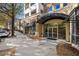 Building entrance featuring a glass entryway and overhead awning along a sidewalk at 870 Inman Village Ne Pkwy # 229, Atlanta, GA 30307