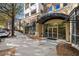 Building entrance at 870 with awning, glass doors, and sidewalk access at 870 Inman Village Ne Pkwy # 229, Atlanta, GA 30307