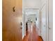 Hallway view of living room with hardwood floors and patio access at 870 Inman Village Ne Pkwy # 229, Atlanta, GA 30307