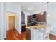 Kitchen featuring granite counters, dark cabinets, breakfast bar with seating at 870 Inman Village Ne Pkwy # 229, Atlanta, GA 30307