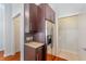 Kitchen area with dark cabinets, granite counters, and stainless steel refrigerator at 870 Inman Village Ne Pkwy # 229, Atlanta, GA 30307