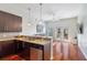 Kitchen open to living room, stainless steel appliances and granite counters at 870 Inman Village Ne Pkwy # 229, Atlanta, GA 30307