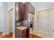 Kitchen area features cabinet space with granite counter and stainless steel refrigerator in unit at 870 Inman Village Ne Pkwy # 229, Atlanta, GA 30307