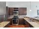Kitchen featuring granite counters, stainless steel appliances, and mosaic backsplash at 870 Inman Village Ne Pkwy # 229, Atlanta, GA 30307