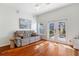 Bright living room with ceiling fan, hardwood floors and glass doors to patio at 870 Inman Village Ne Pkwy # 229, Atlanta, GA 30307