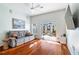 Bright living room featuring hardwood floors and glass doors to private patio at 870 Inman Village Ne Pkwy # 229, Atlanta, GA 30307