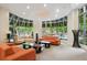 Bright lounge area with ample seating and floor-to-ceiling windows with neighborhood views at 870 Inman Village Ne Pkwy # 229, Atlanta, GA 30307