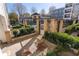 Pool area with lounge chairs, landscaping, and view of surrounding apartment complex at 870 Inman Village Ne Pkwy # 229, Atlanta, GA 30307