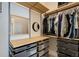 Walk-in closet with drawers, shelving and hanging storage for clothes and accessories at 870 Inman Village Ne Pkwy # 229, Atlanta, GA 30307