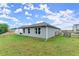 Backyard featuring a well-maintained lawn, a privacy fence, and mature trees at 99 Oxford Ln, Kingston, GA 30145