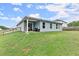 Backyard featuring a well-maintained lawn, a privacy fence, and an outdoor seating area at 99 Oxford Ln, Kingston, GA 30145