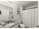 Well lit bathroom featuring granite countertops, tiled floors, and modern fixtures at 99 Oxford Ln, Kingston, GA 30145