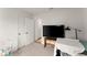Bedroom with a large TV, closet, and a play area at 99 Oxford Ln, Kingston, GA 30145
