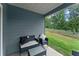 A cozy patio featuring outdoor seating and views of the grassy lawn at 99 Oxford Ln, Kingston, GA 30145