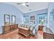 Serene blue bedroom with hardwood floors, vaulted ceiling, and matching nightstands on each side at 2318 Chancery Mill Ln, Buford, GA 30519