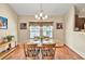 Bright and airy dining room with hardwood floors and natural light at 2318 Chancery Mill Ln, Buford, GA 30519