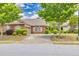 Beautiful brick home featuring meticulous landscaping, a two-car garage and inviting curb appeal at 2318 Chancery Mill Ln, Buford, GA 30519