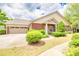 Charming brick home with a two-car garage and a well-manicured lawn, perfect for curb appeal at 2318 Chancery Mill Ln, Buford, GA 30519