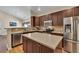 Modern kitchen featuring stainless steel appliances, sleek cabinetry, and a convenient center island at 2318 Chancery Mill Ln, Buford, GA 30519