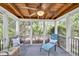 Inviting screened porch with wood ceiling and ceiling fan, and lounge chair with outdoor seating at 2318 Chancery Mill Ln, Buford, GA 30519