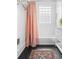 Bright bathroom features black herringbone tile floors and subway tile walls at 291 Elmira Ne Pl, Atlanta, GA 30307
