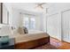 Bedroom features hardwood floors, large bed, and neutral walls at 291 Elmira Ne Pl, Atlanta, GA 30307