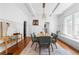 Elegant dining room with decorative rug, stylish light fixture, and ample seating for Gathering meals and gatherings at 291 Elmira Ne Pl, Atlanta, GA 30307