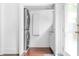 A laundry room with stacked washer and dryer units and a door leading to the outside at 291 Elmira Ne Pl, Atlanta, GA 30307