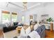 Bright living room featuring hardwood floors, modern furniture, and large windows offering ample natural light at 291 Elmira Ne Pl, Atlanta, GA 30307