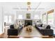 Bright living room with hardwood floors, coffered ceilings, a fireplace, and built-in bookshelves at 291 Elmira Ne Pl, Atlanta, GA 30307